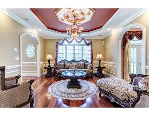 11 Bramble Lane Sharon, MA 02067 - Photo 9 of 30 a living room with furniture a chandelier and a large window