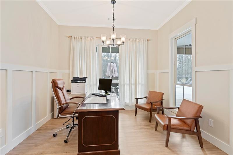 301 Roy Morgan Road Carrollton, GA 30116 - Photo 12 of 35 a view of a workspace with furniture and a window