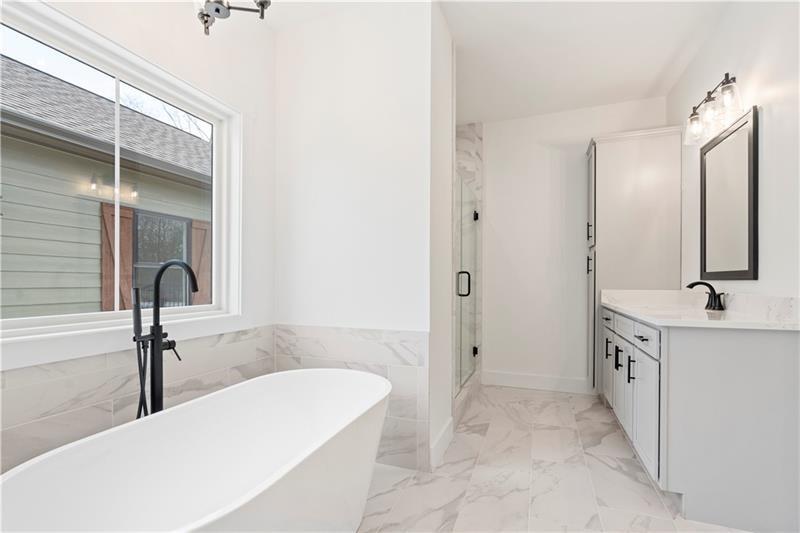 301 Roy Morgan Road Carrollton, GA 30116 - Photo 23 of 35 a bathroom with a tub sink and mirror