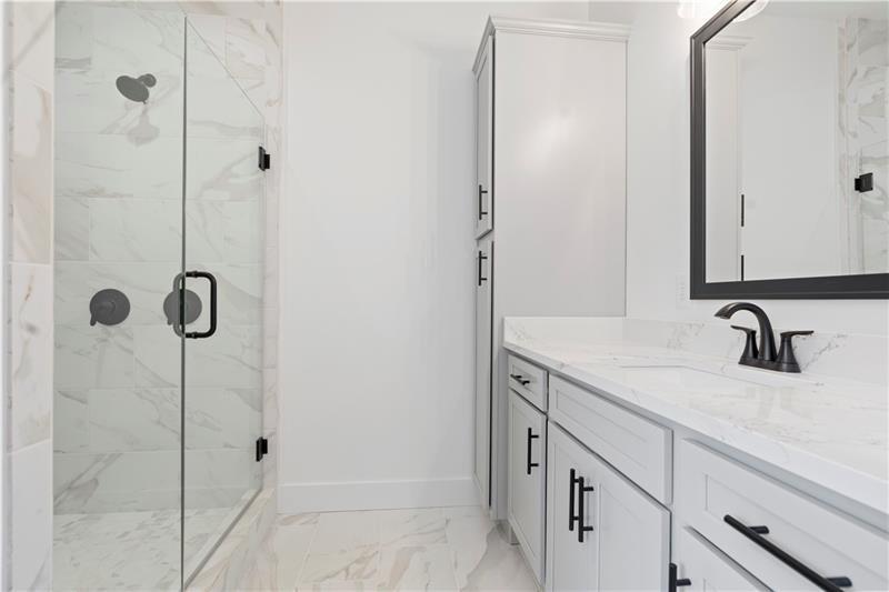 301 Roy Morgan Road Carrollton, GA 30116 - Photo 24 of 35 a bathroom with a sink and a mirror