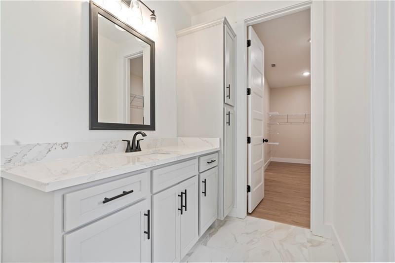 301 Roy Morgan Road Carrollton, GA 30116 - Photo 26 of 35 a bathroom with a sink and a mirror