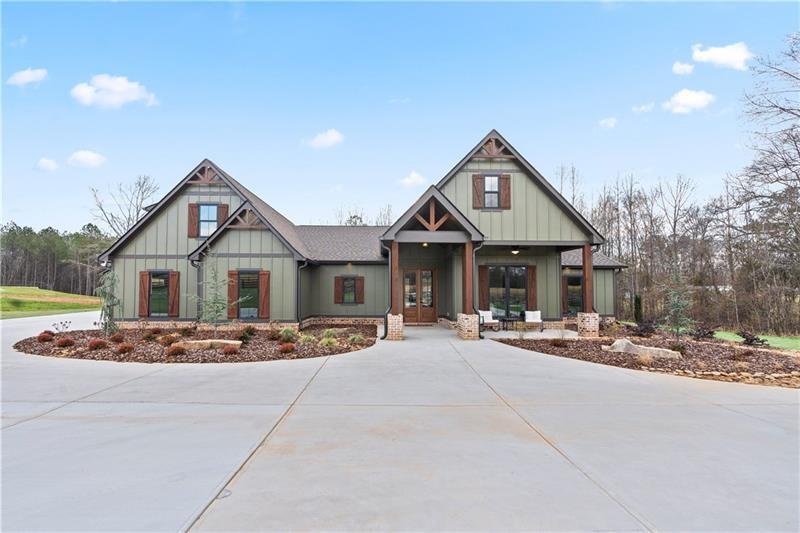 301 Roy Morgan Road Carrollton, GA 30116 - Photo 3 of 35 a front view of a house with a yard