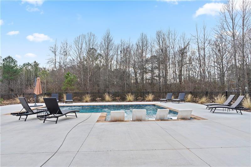 301 Roy Morgan Road Carrollton, GA 30116 - Photo 32 of 35 a view of swimming pool with chairs and trees