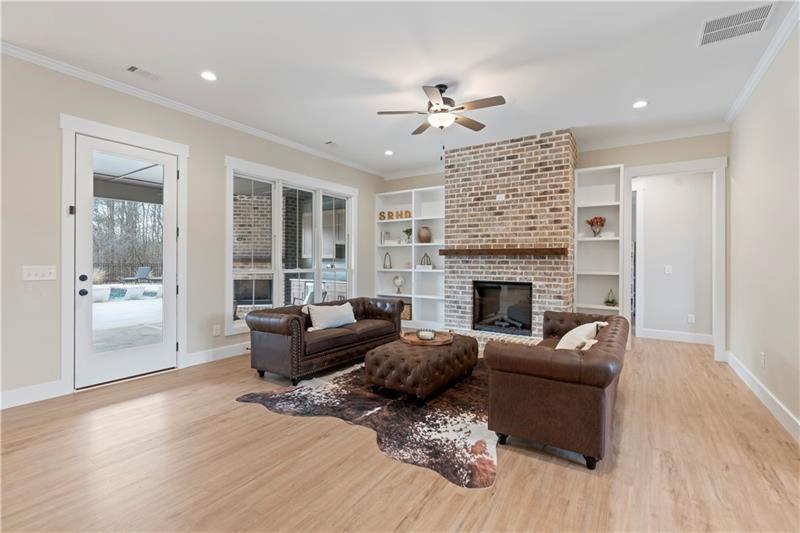 301 Roy Morgan Road Carrollton, GA 30116 - Photo 5 of 35 a living room with furniture and a fireplace