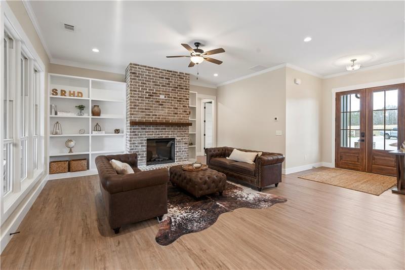 301 Roy Morgan Road Carrollton, GA 30116 - Photo 7 of 35 a living room with furniture and a fireplace
