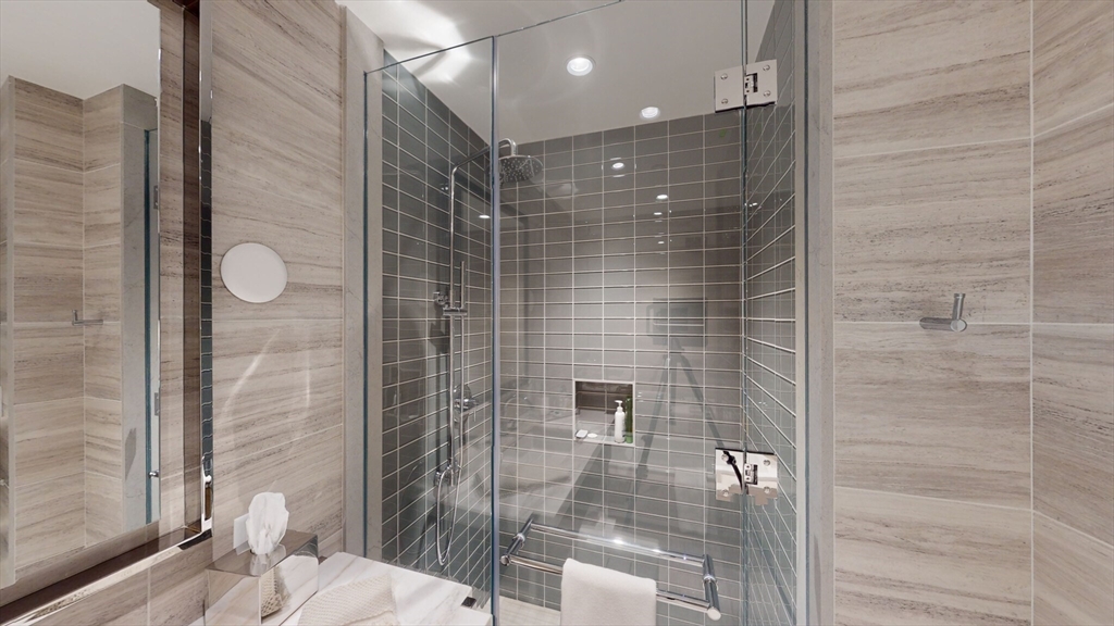 40 Trinity Place, Unit 1503 Boston, MA 02116 - Photo 5 of 14 a bathroom with a shower and a sink