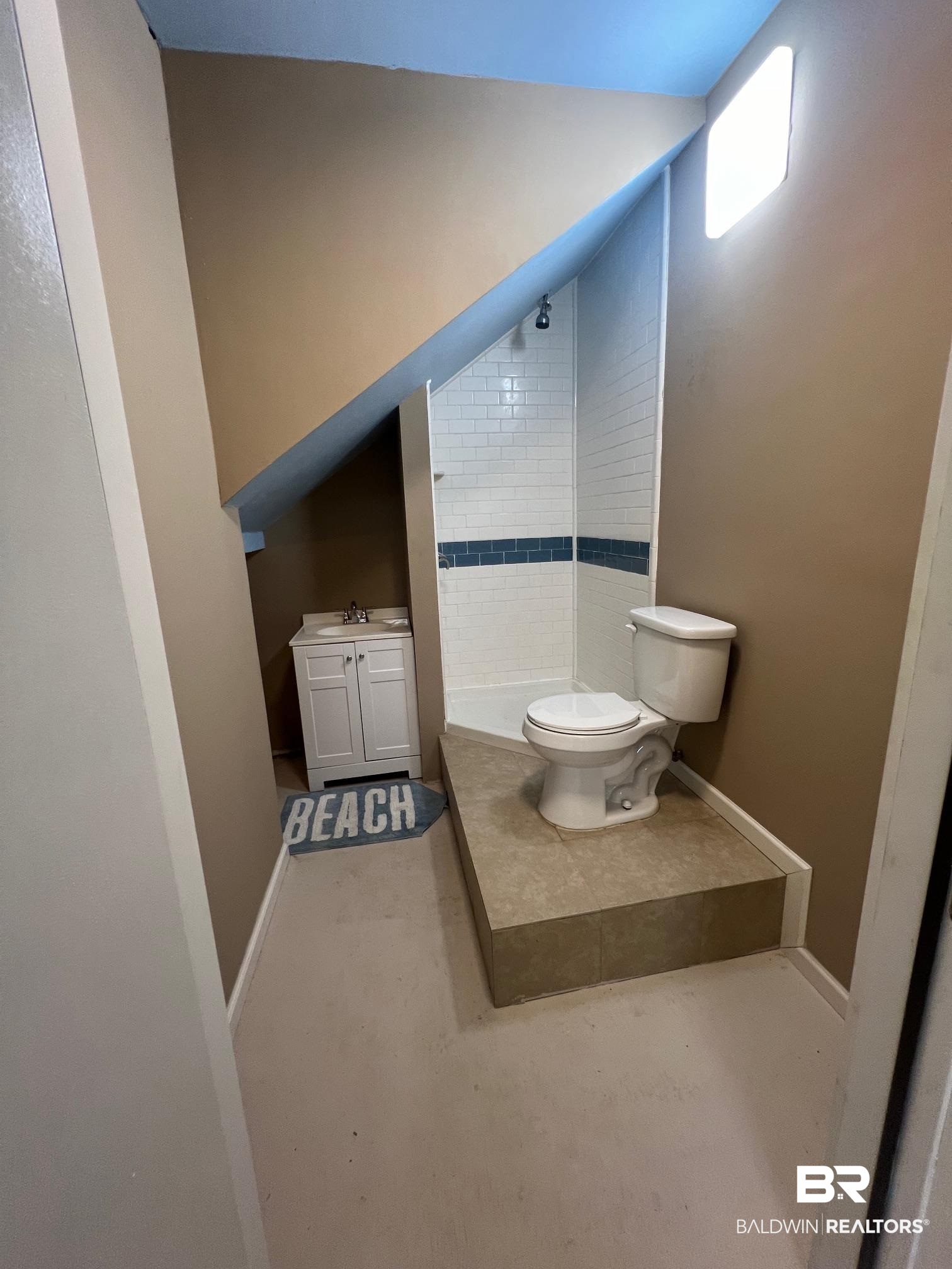 1985 Ridgewood Drive South Lillian, AL 36549 - Photo 15 of 40 Bathroom with vanity, toilet, and concrete flooring