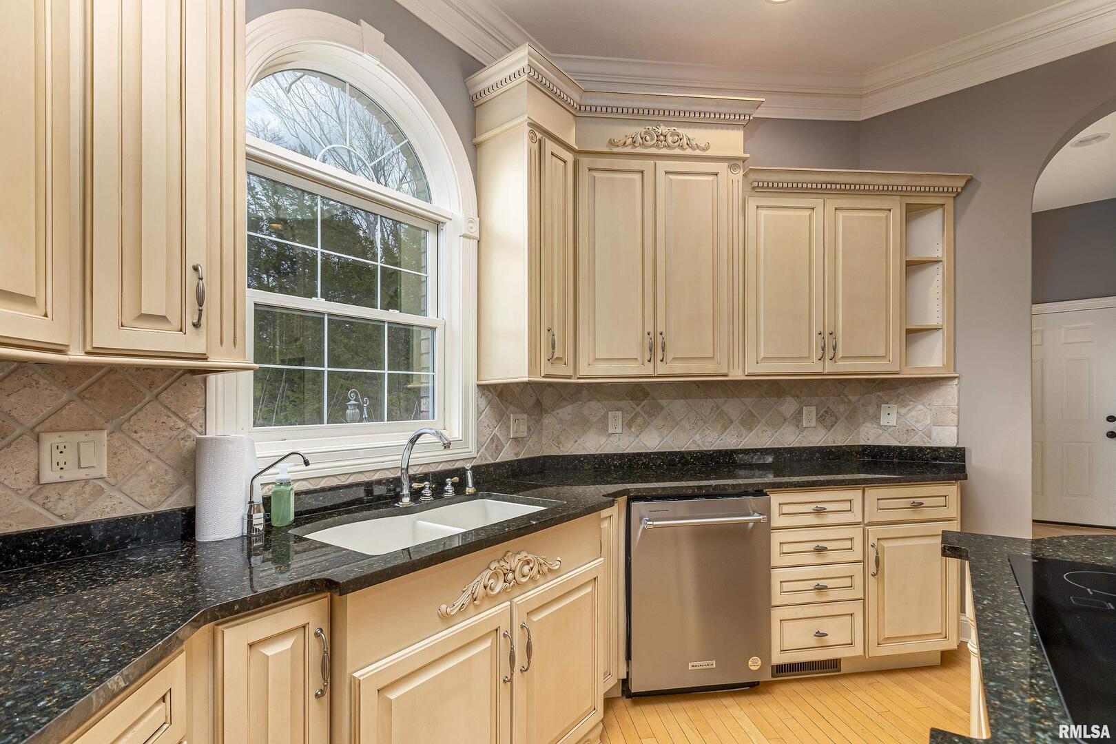 3115 West Striegel Road Carbondale, IL 62901 - Photo 24 of 54 a kitchen with granite countertop a sink a stove and cabinets