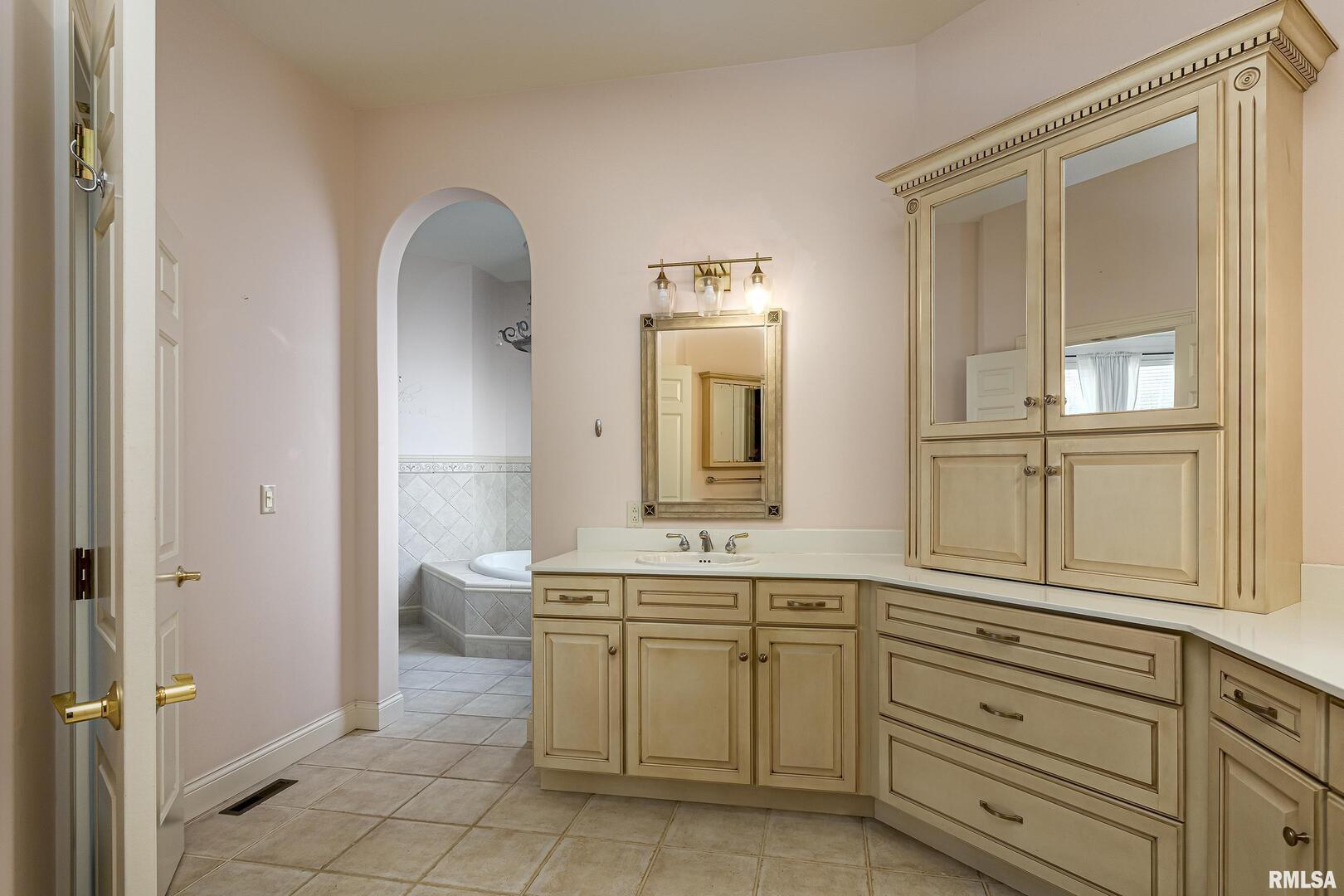 3115 West Striegel Road Carbondale, IL 62901 - Photo 36 of 54 a bathroom with a sink a toilet and a mirror