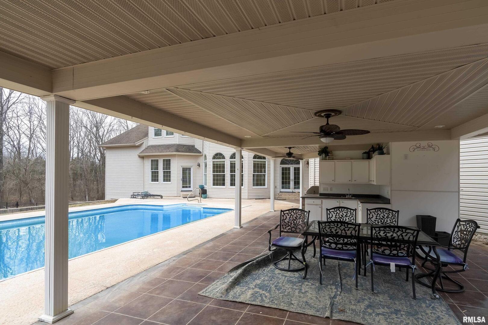 3115 West Striegel Road Carbondale, IL 62901 - Photo 45 of 54 a view of a patio with a table chairs and backyard