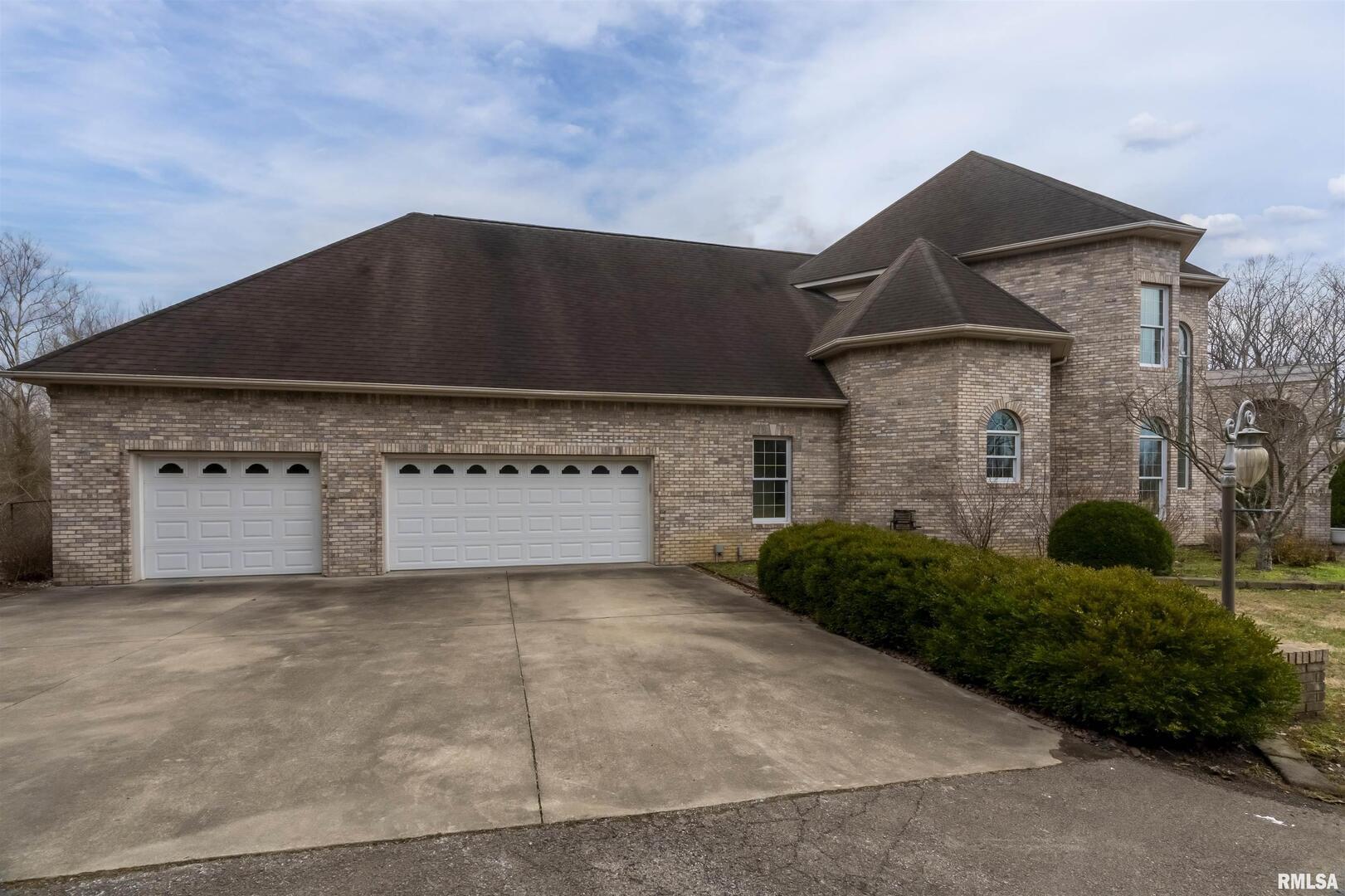 3115 West Striegel Road Carbondale, IL 62901 - Photo 46 of 54 a front view of a house with garage