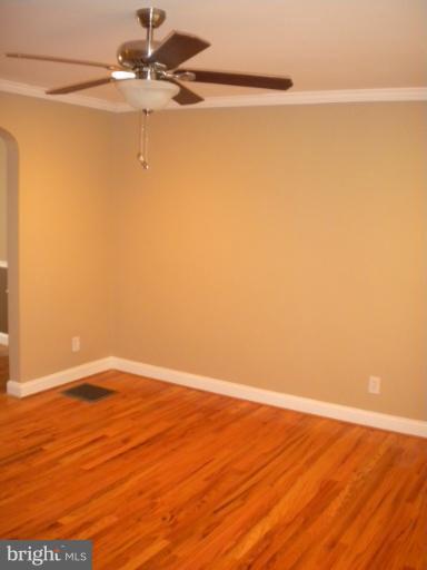 812 Wicklow Road Baltimore, MD 21229 - Photo 23 of 30 a view of a small space with wooden floor and a fan