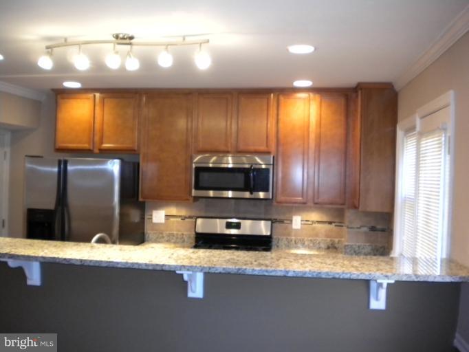 812 Wicklow Road Baltimore, MD 21229 - Photo 30 of 30 a kitchen with refrigerator and window