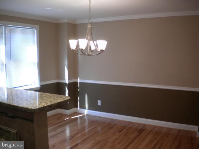 812 Wicklow Road Baltimore, MD 21229 - Photo 3 of 30 a view of kitchen with granite countertop cabinets and wooden floor