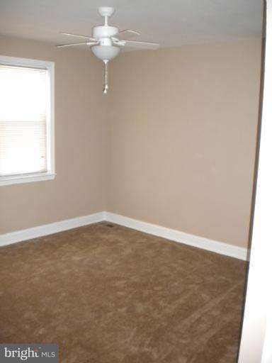 812 Wicklow Road Baltimore, MD 21229 - Photo 5 of 30 an empty room with a window