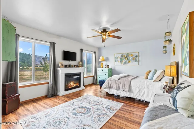 a spacious bedroom with a bed and a fireplace