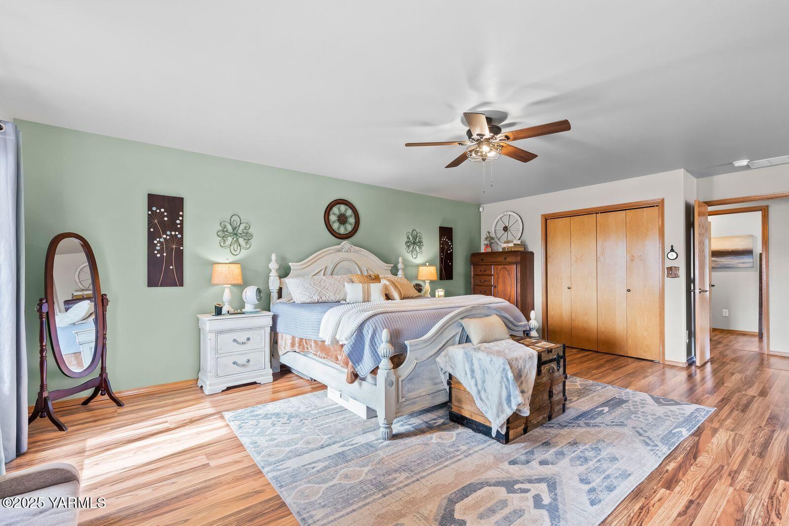 1880 Dilley Road Tieton, WA 98947 - Photo 27 of 45 a bedroom with bed and a chandelier