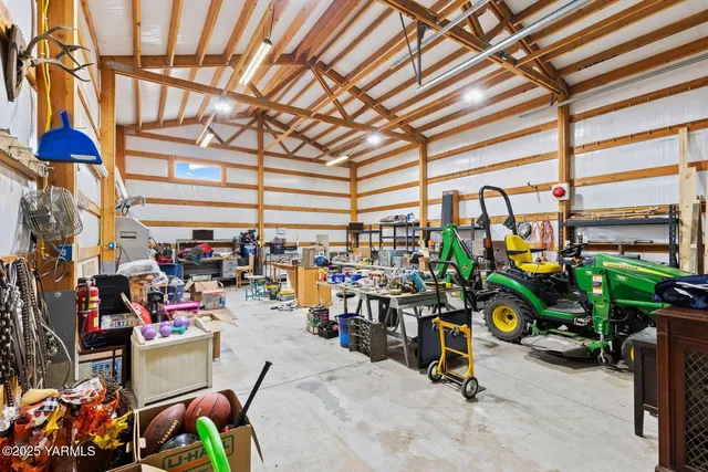a view of an house with backyard space and balcony