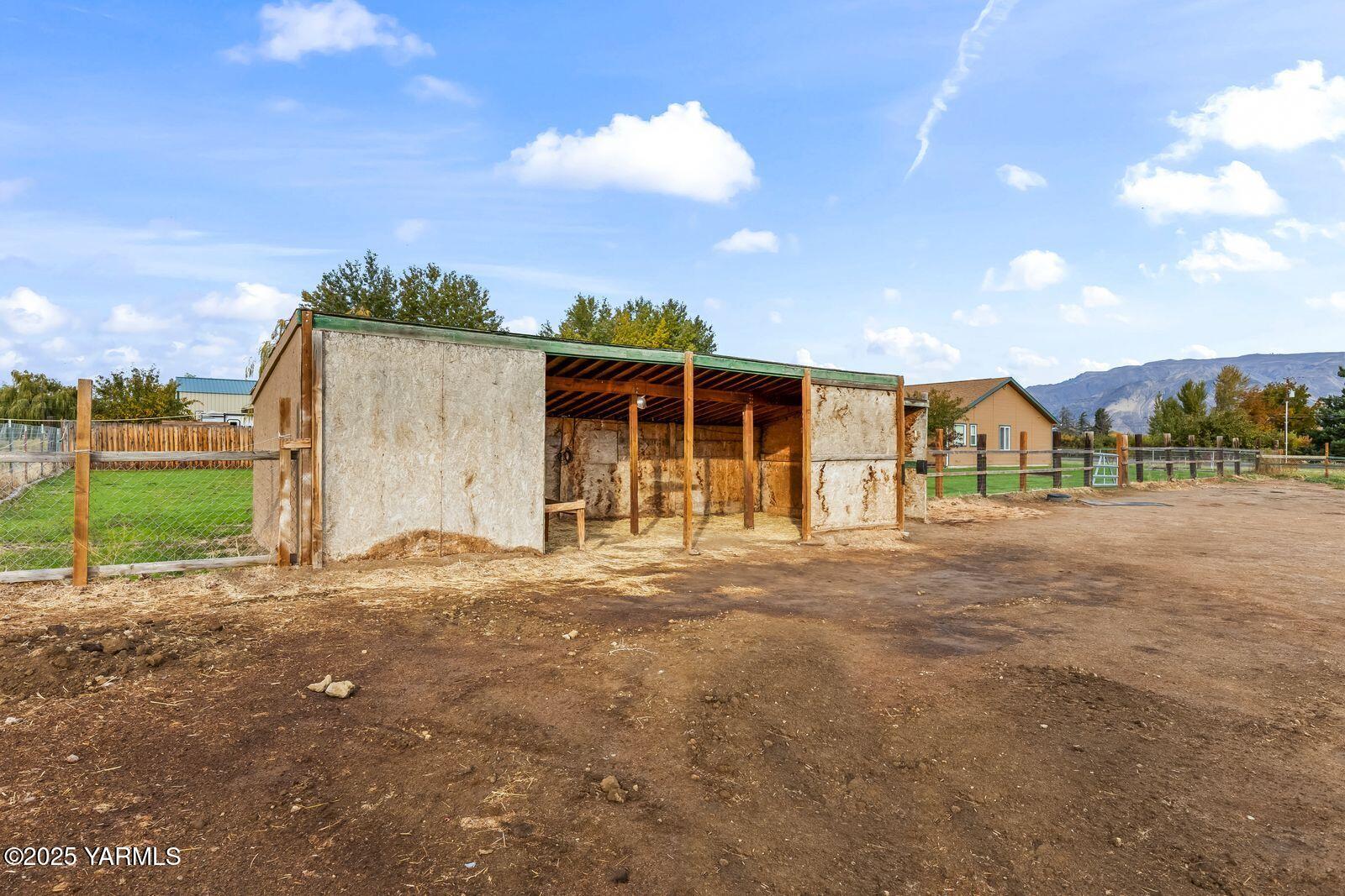 1880 Dilley Road Tieton, WA 98947 - Photo 39 of 45 a view of a house with backyard and a tree