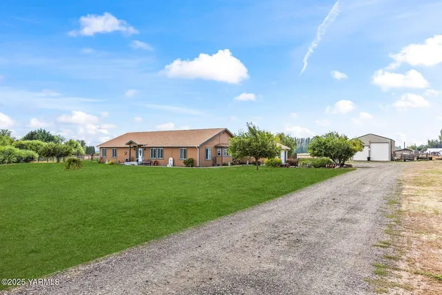 a view of a street with a building in the background