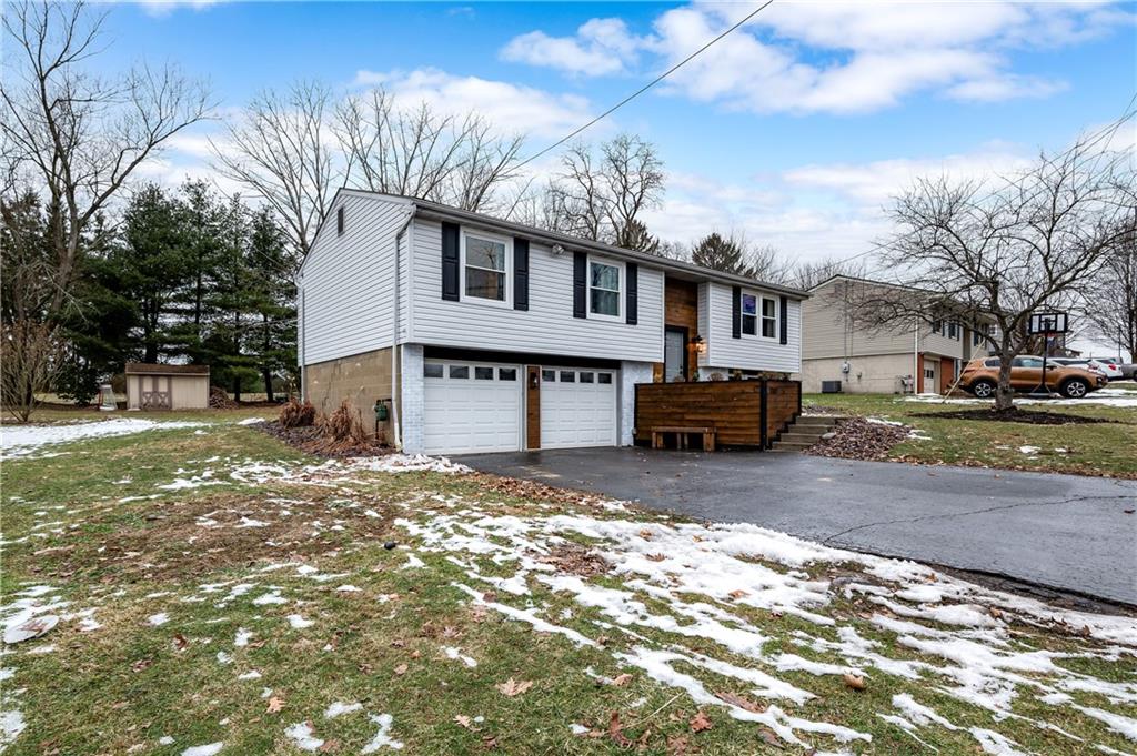 110 Avon Drive Butler, PA 16001 - Photo 2 of 35 a front view of a house with a yard covered with snow