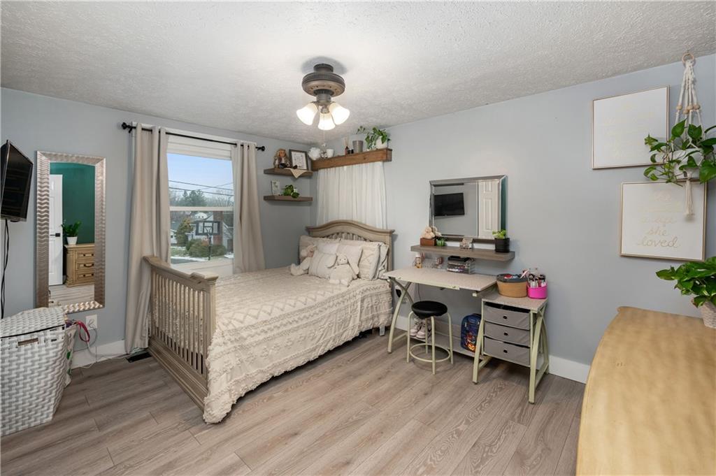 110 Avon Drive Butler, PA 16001 - Photo 21 of 35 a bedroom with a bed and a table in it