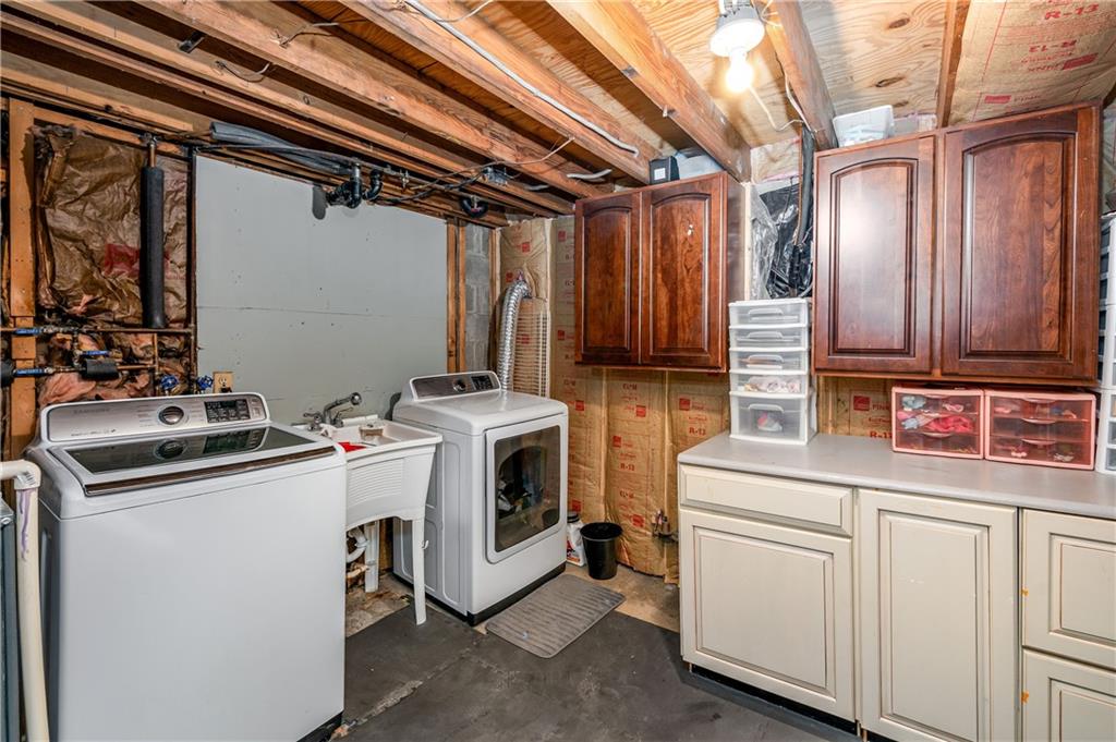 110 Avon Drive Butler, PA 16001 - Photo 26 of 35 a view of a storage & utility room with dryer and washer