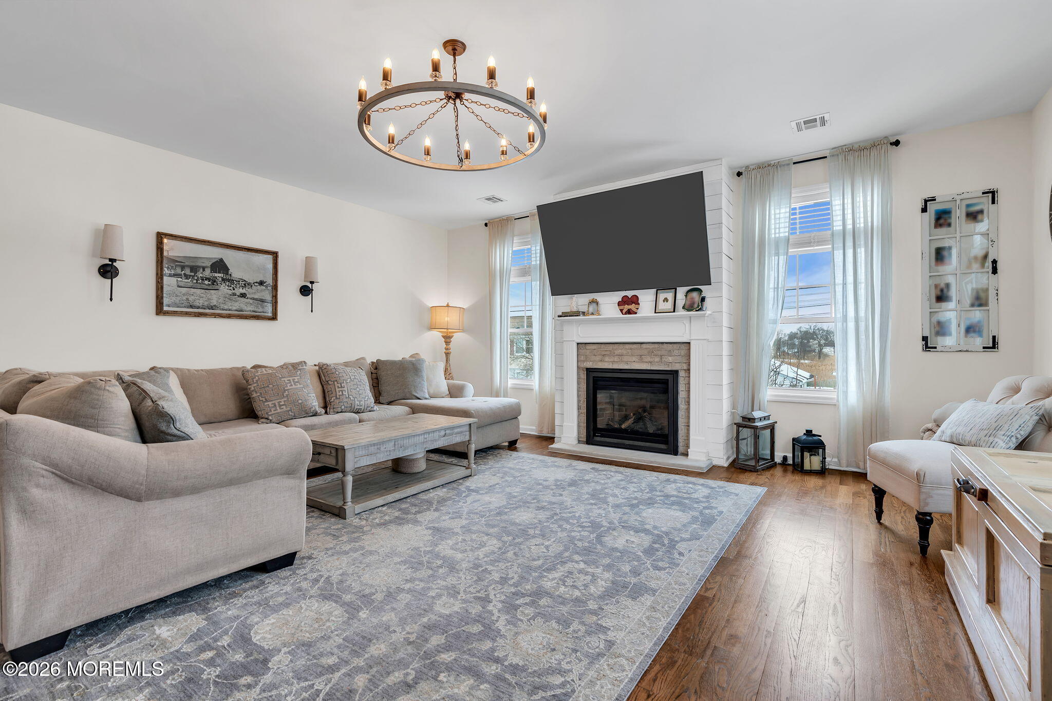 1202 High Avenue Union Beach, NJ 07735 - Photo 14 of 44 a living room with furniture a flat screen tv and a fireplace