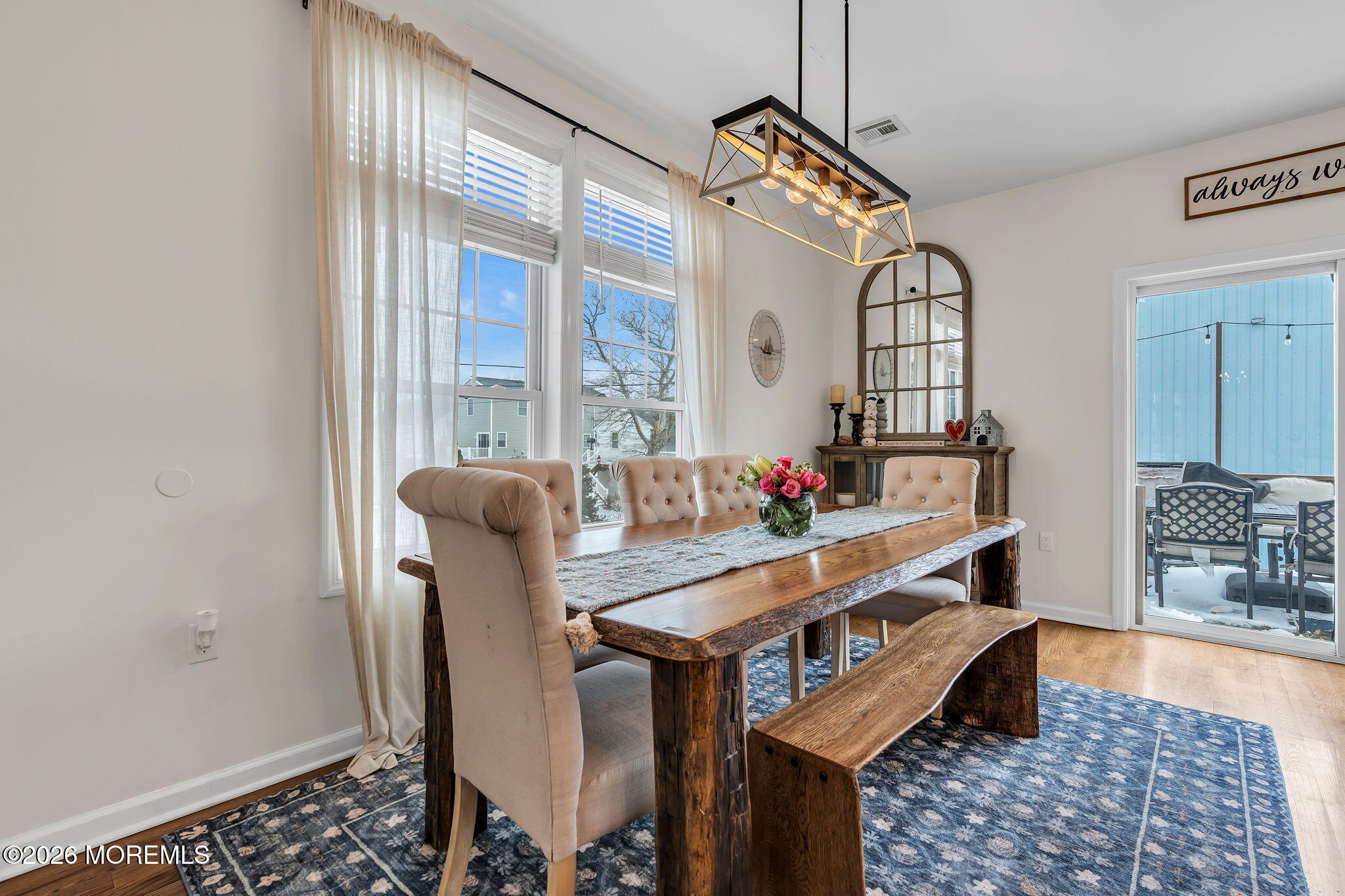 1202 High Avenue Union Beach, NJ 07735 - Photo 16 of 44 a view of a dining room with furniture window and wooden floor