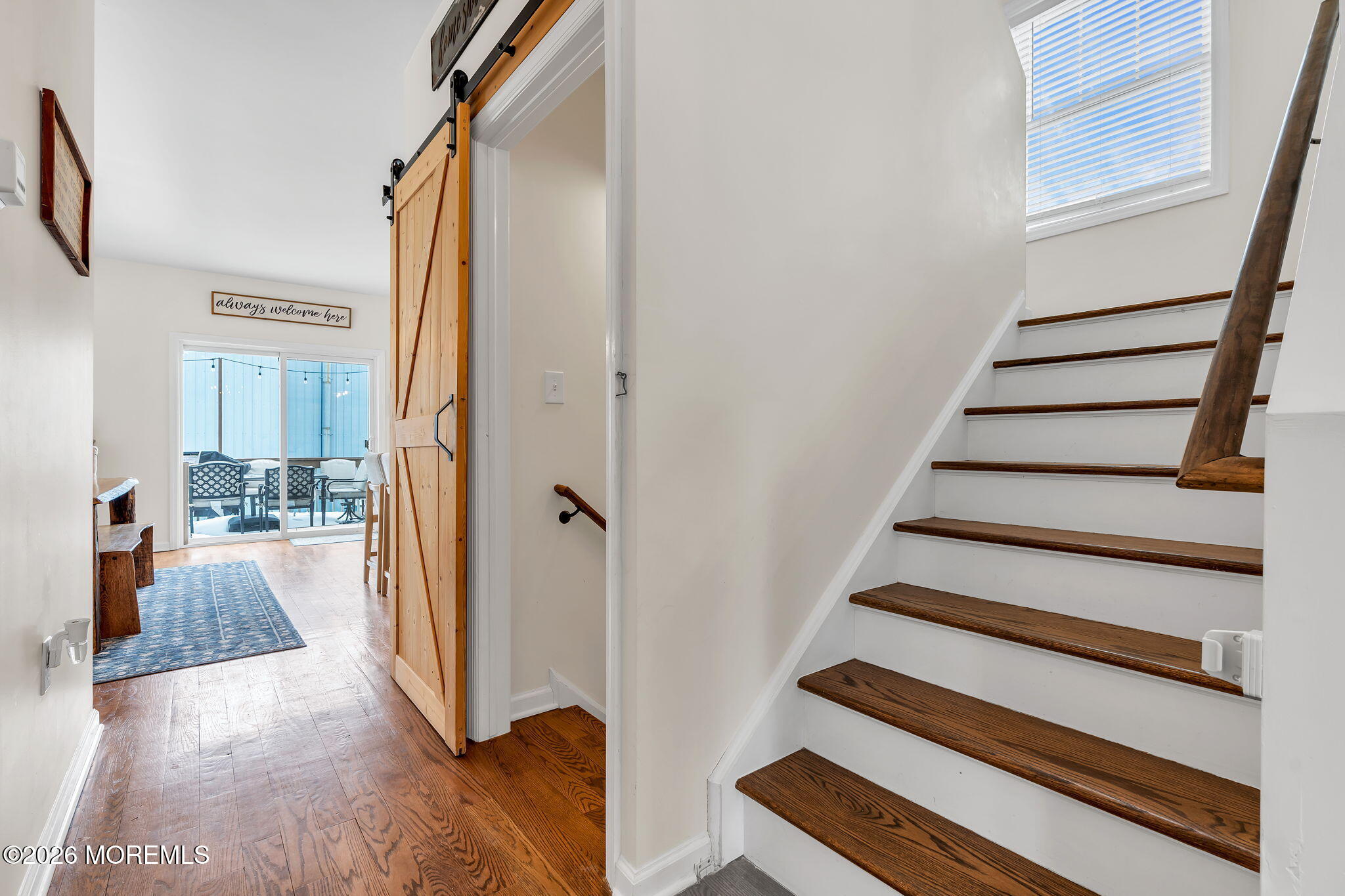 1202 High Avenue Union Beach, NJ 07735 - Photo 23 of 44 a view of a hallway with wooden floor and staircase