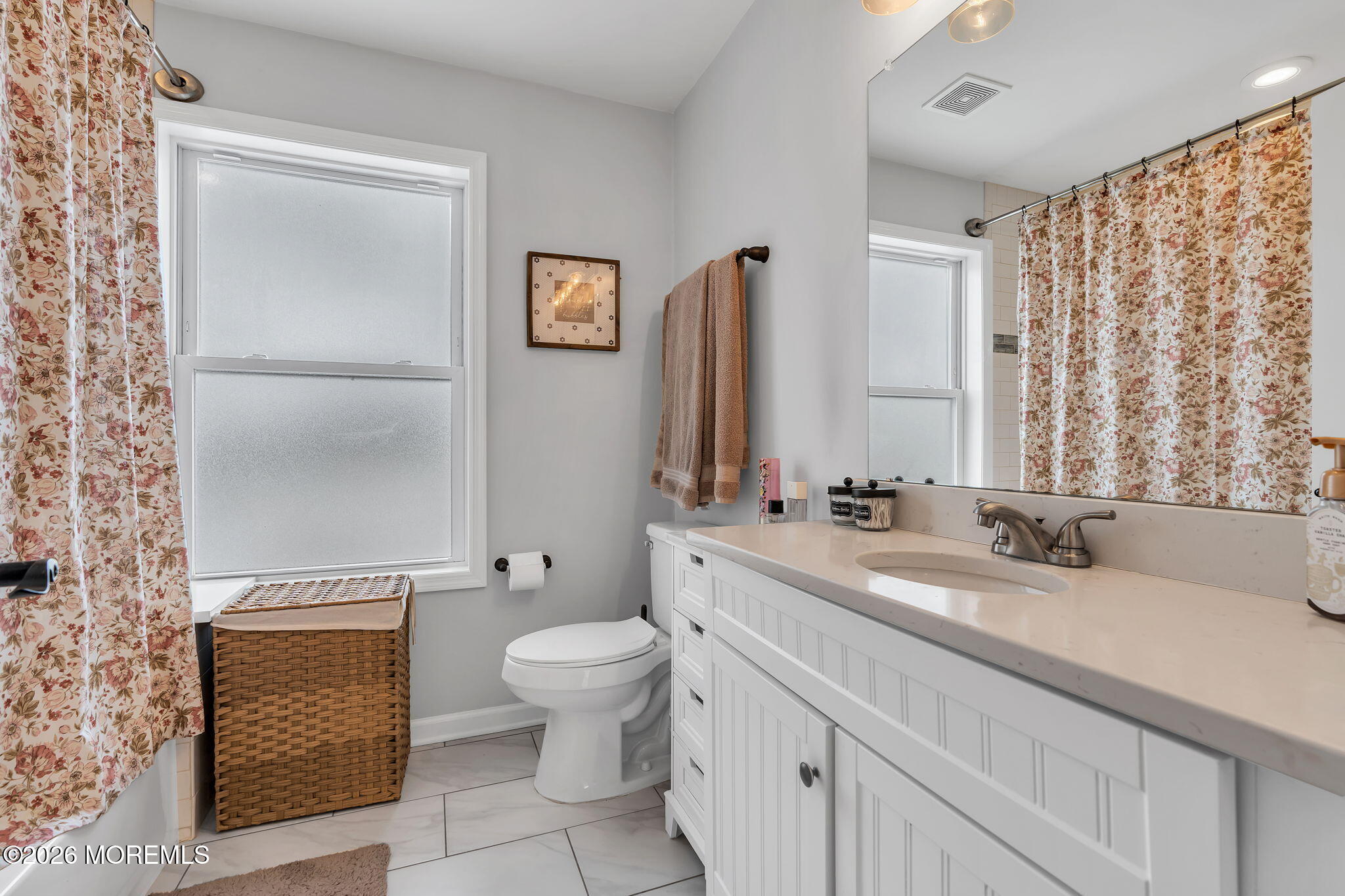 1202 High Avenue Union Beach, NJ 07735 - Photo 25 of 44 a bathroom with a sink a toilet and a mirror