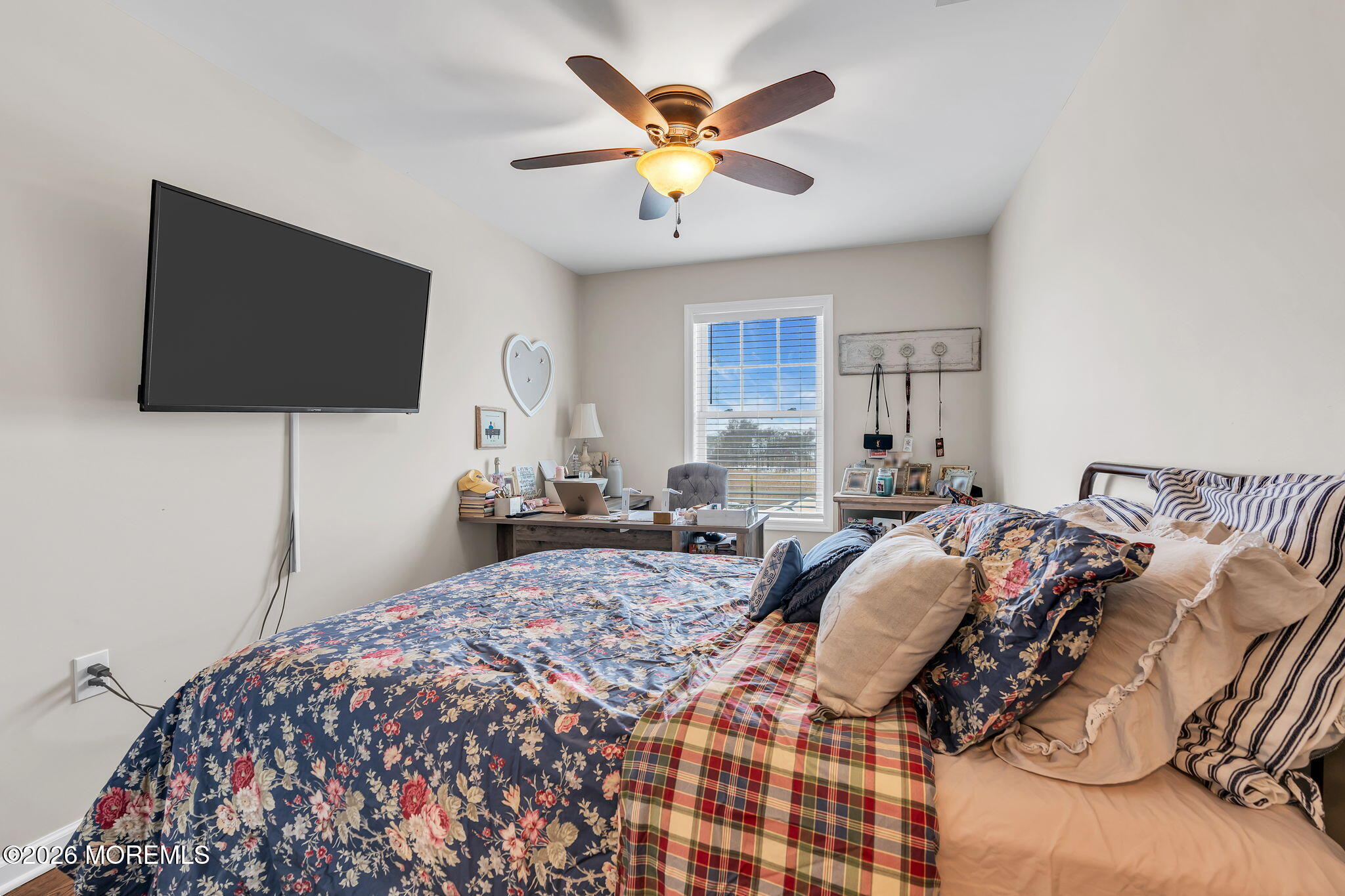 1202 High Avenue Union Beach, NJ 07735 - Photo 28 of 44 a bedroom with a bed and a flat screen tv