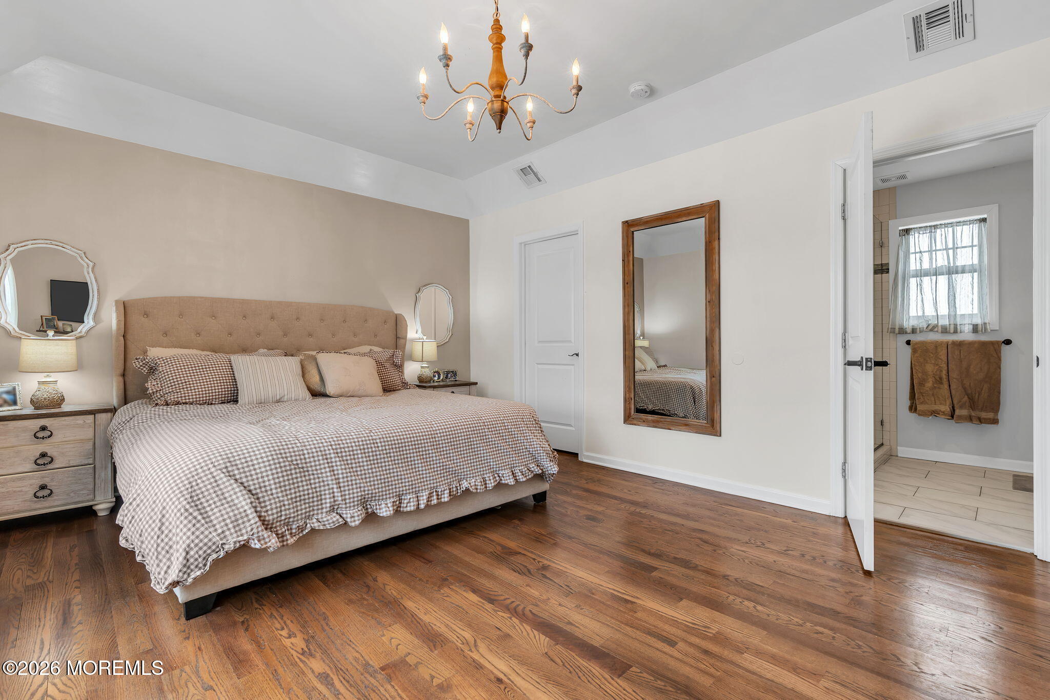 1202 High Avenue Union Beach, NJ 07735 - Photo 30 of 44 a bedroom with a bed chandelier and a window
