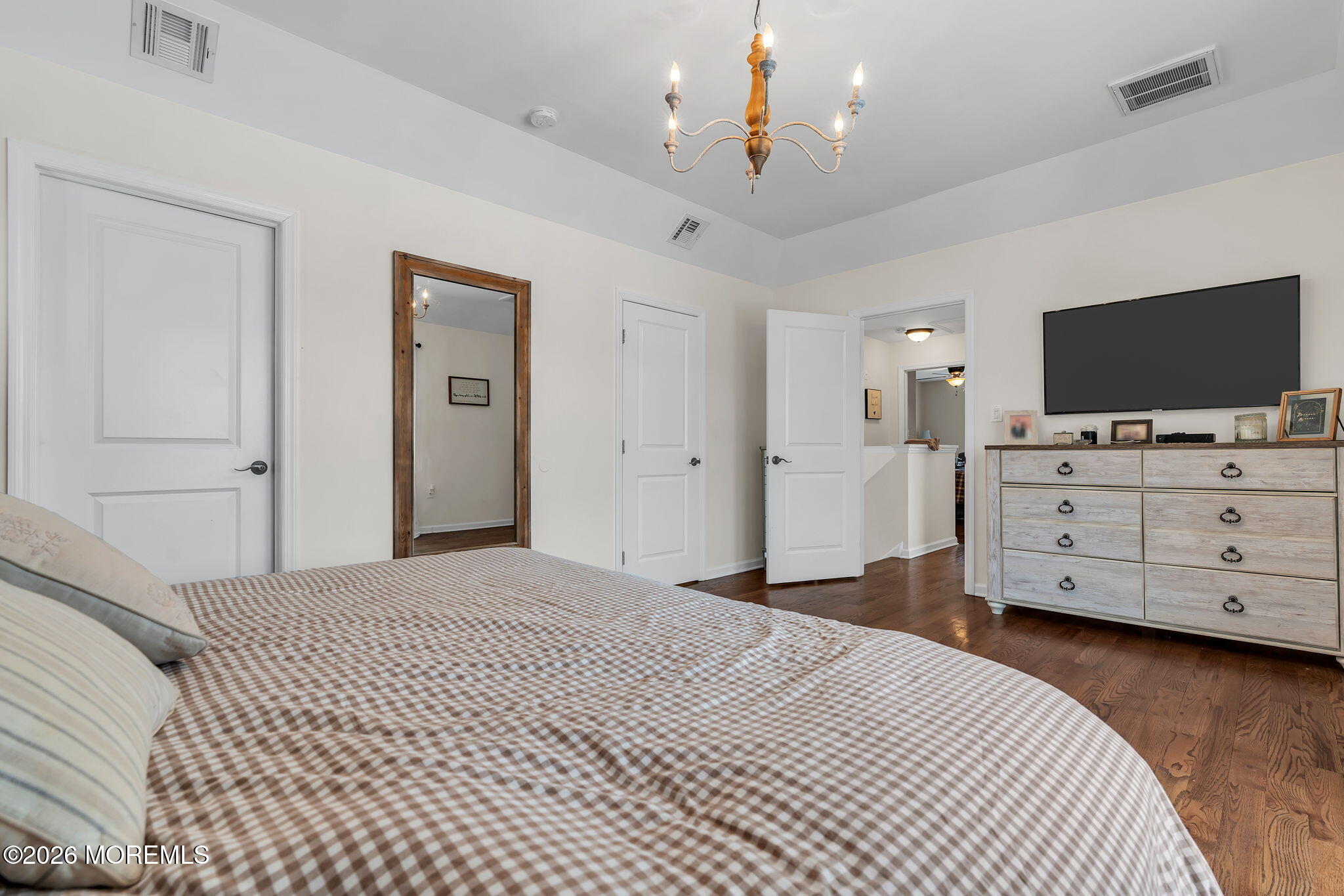 1202 High Avenue Union Beach, NJ 07735 - Photo 31 of 44 a bedroom with a bed and flat screen tv