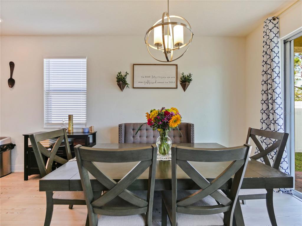 4553 Baler Trails Drive St. Cloud, FL 34772 - Photo 15 of 32 a view of a dining room with furniture and chandelier