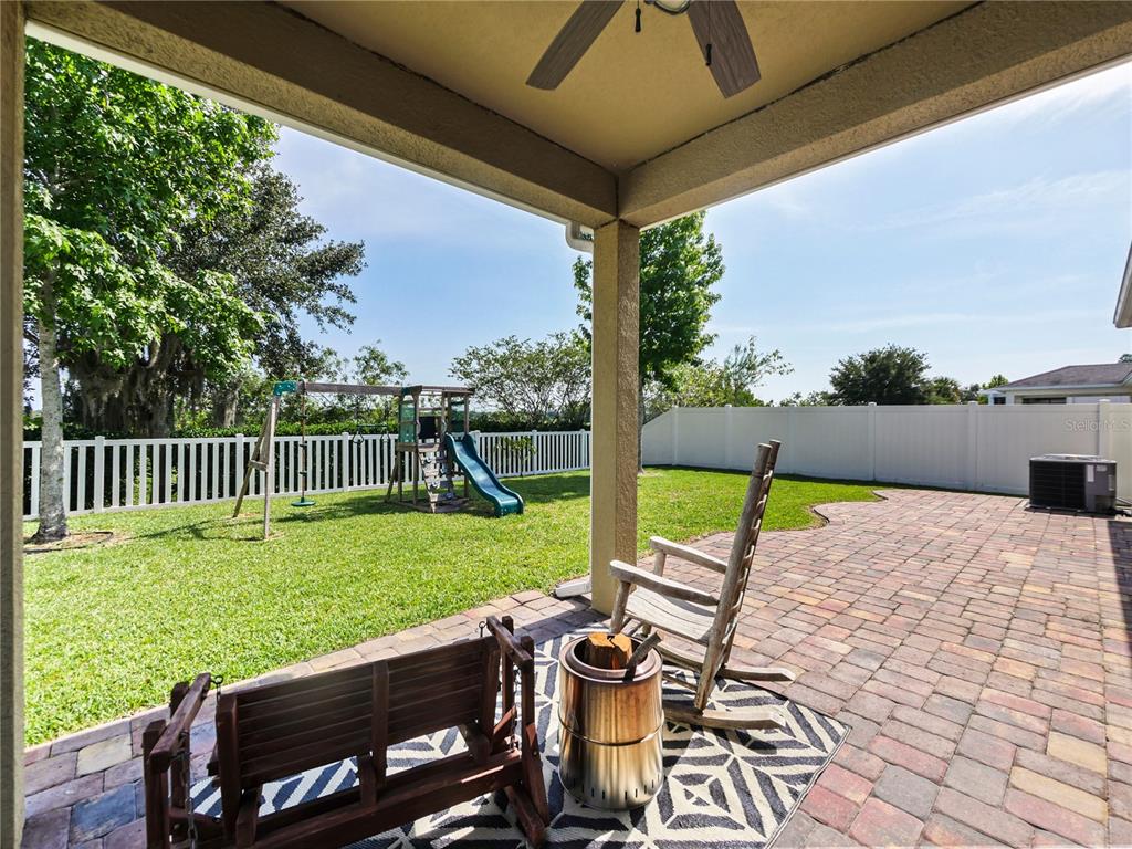 4553 Baler Trails Drive St. Cloud, FL 34772 - Photo 23 of 32 a view of a patio with a yard