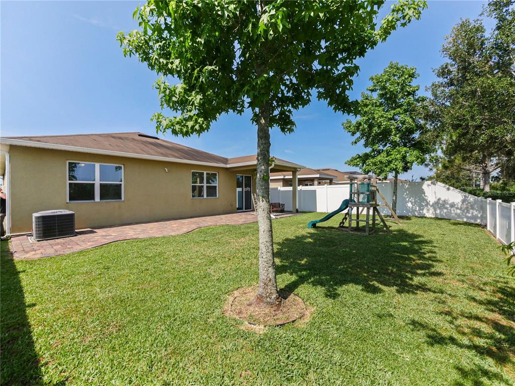 4553 Baler Trails Drive St. Cloud, FL 34772 - Photo 26 of 32 a house view with a garden space