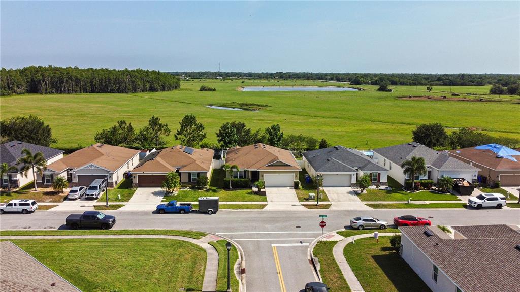 4553 Baler Trails Drive St. Cloud, FL 34772 - Photo 28 of 32 a view of a swimming pool and outside seating area