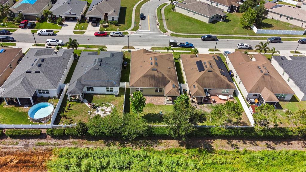 4553 Baler Trails Drive St. Cloud, FL 34772 - Photo 30 of 32 an aerial view of residential houses with outdoor space and parking