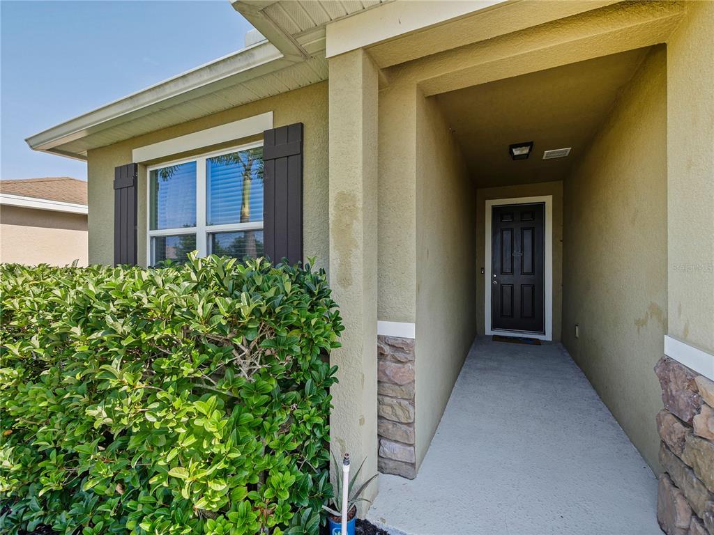 4553 Baler Trails Drive St. Cloud, FL 34772 - Photo 5 of 32 view of a house with a small yard