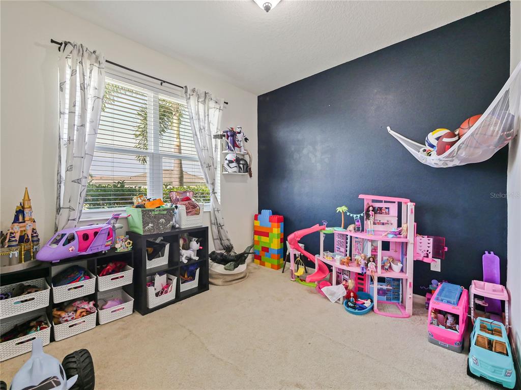 4553 Baler Trails Drive St. Cloud, FL 34772 - Photo 6 of 32 a living room with furniture and a window