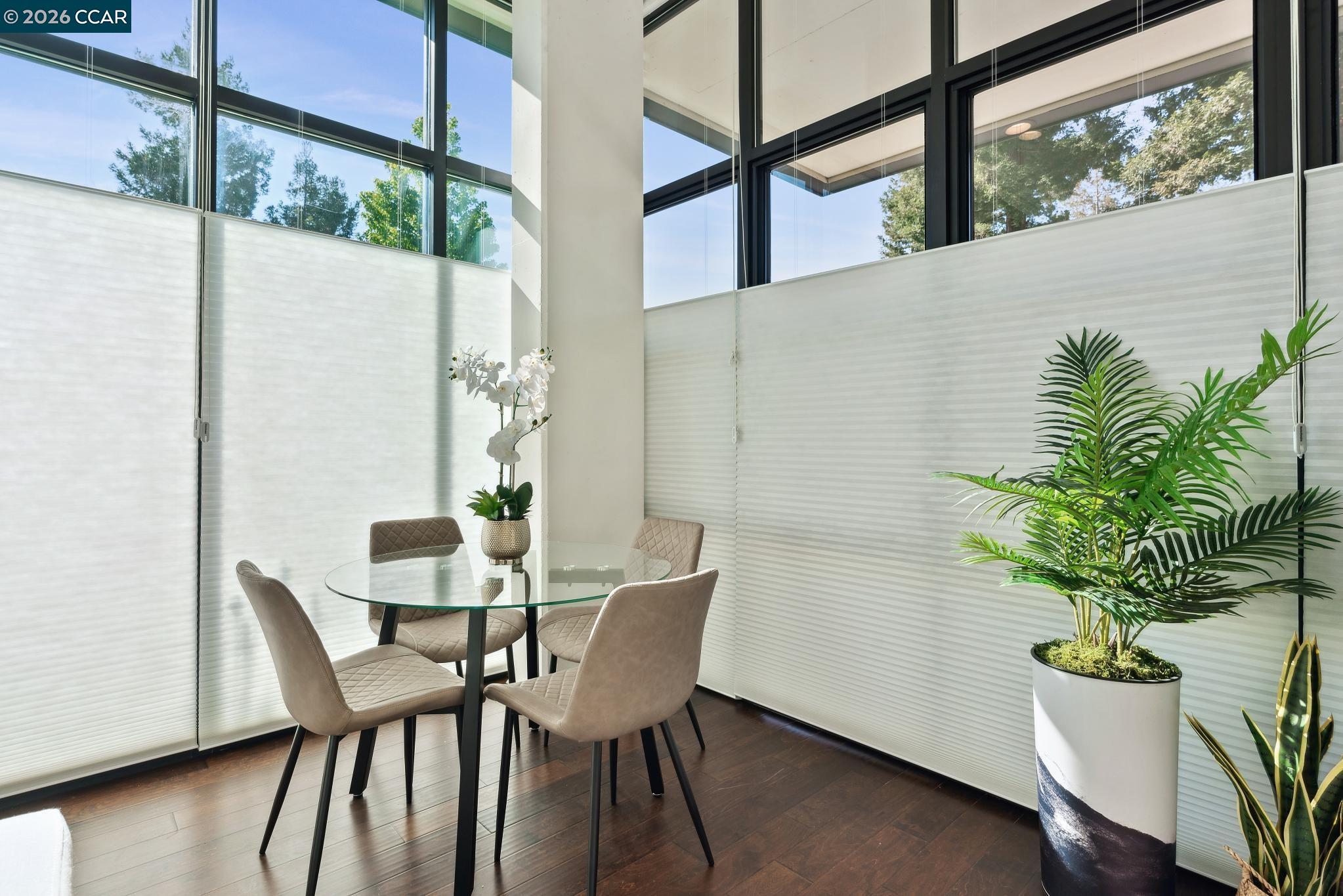 210 Lafayette Circle, Unit 101 Lafayette, CA 94549 - Photo 18 of 41 a view of a dining room with furniture window and wooden floor