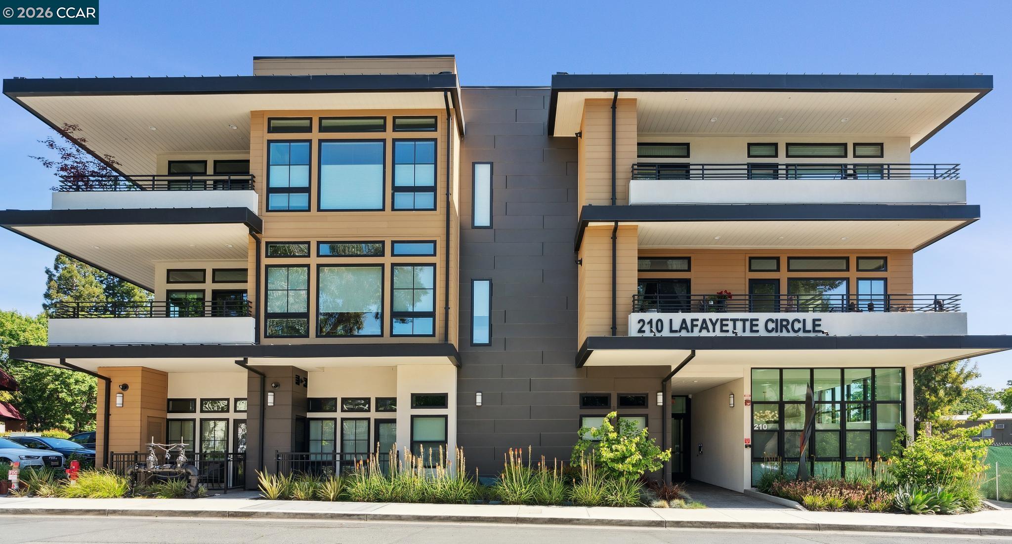 210 Lafayette Circle, Unit 101 Lafayette, CA 94549 - Photo 2 of 41 front view of a building with a garden