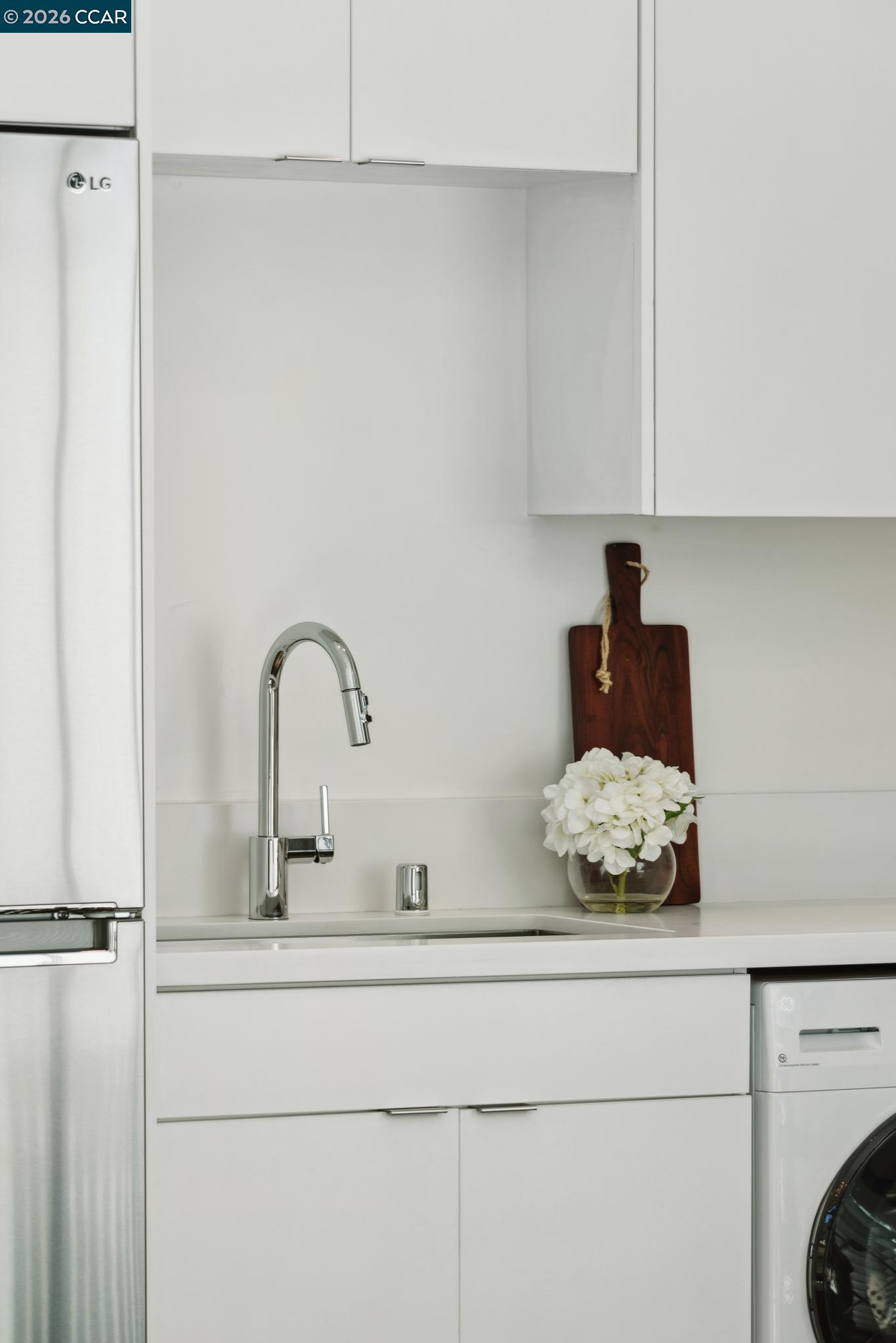 210 Lafayette Circle, Unit 101 Lafayette, CA 94549 - Photo 23 of 41 a bathroom with a sink and cabinets