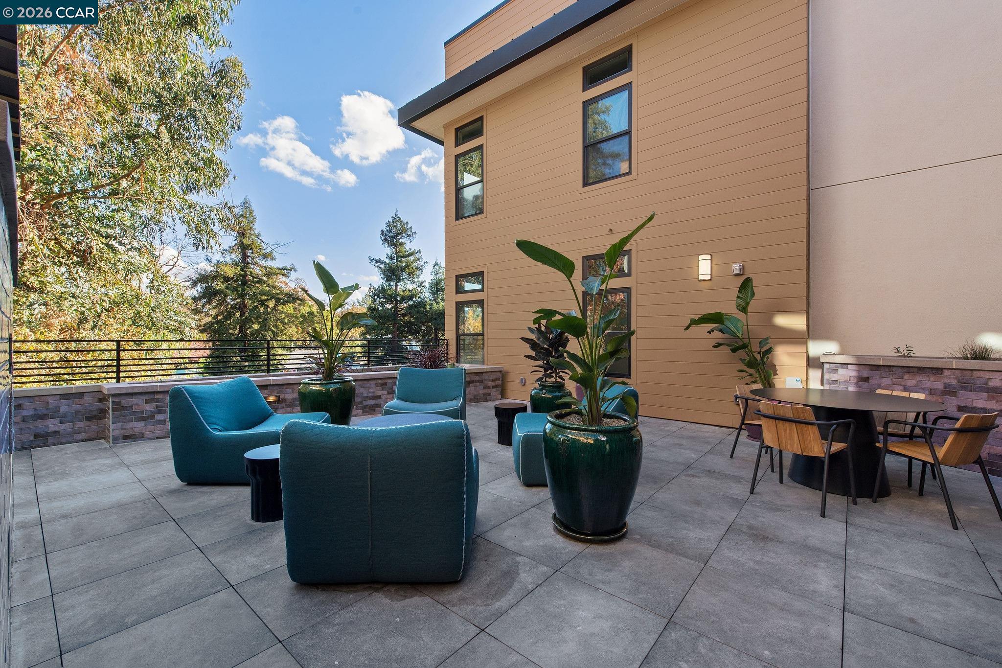 210 Lafayette Circle, Unit 101 Lafayette, CA 94549 - Photo 34 of 41 a view of a patio with couches and potted plants