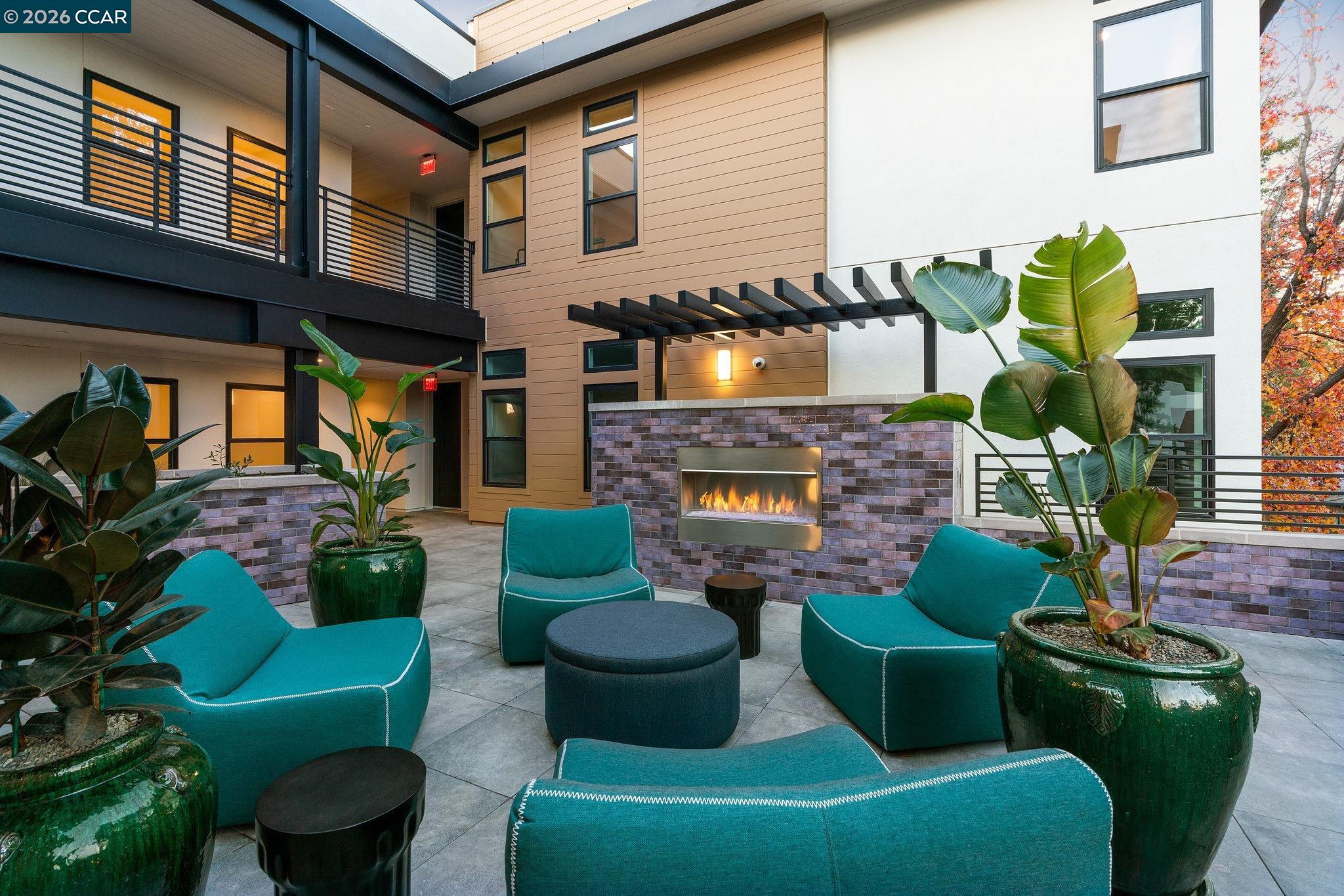 210 Lafayette Circle, Unit 101 Lafayette, CA 94549 - Photo 41 of 41 a front view of a house with outdoor seating and a potted plant