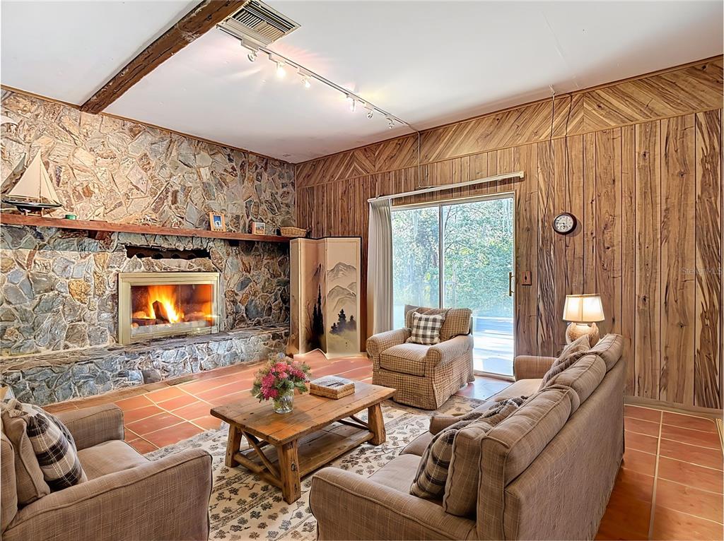 22380 Powell Road Brooksville, FL 34602 - Photo 3 of 45 a living room with furniture and a fireplace