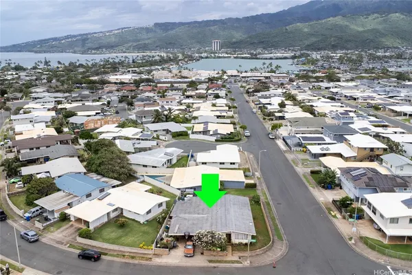 an aerial view of residential houses with outdoor space