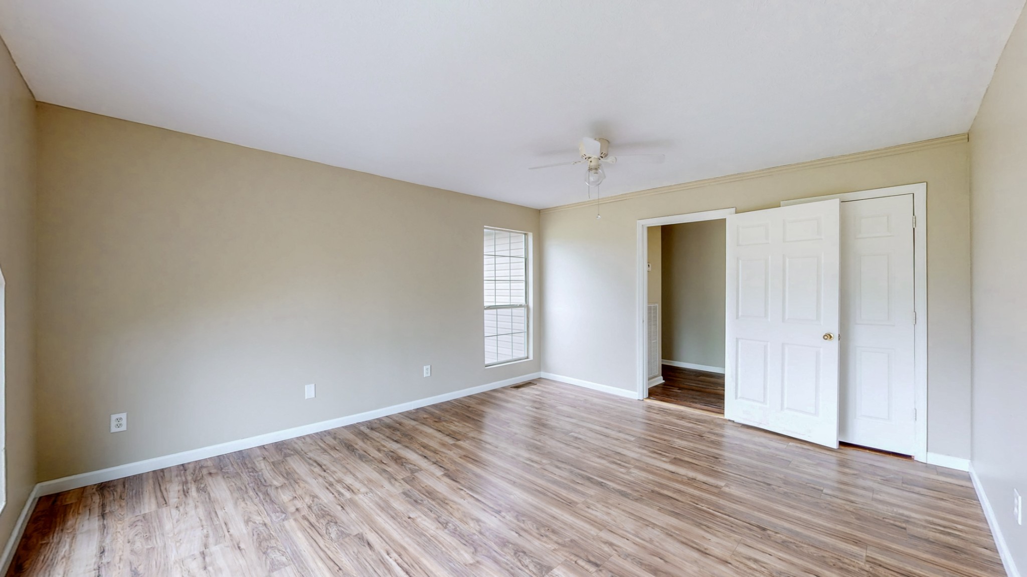 75 Vantrease Road Brush Creek, TN 38547 - Photo 16 of 72 a view of an empty room with window and wooden floor