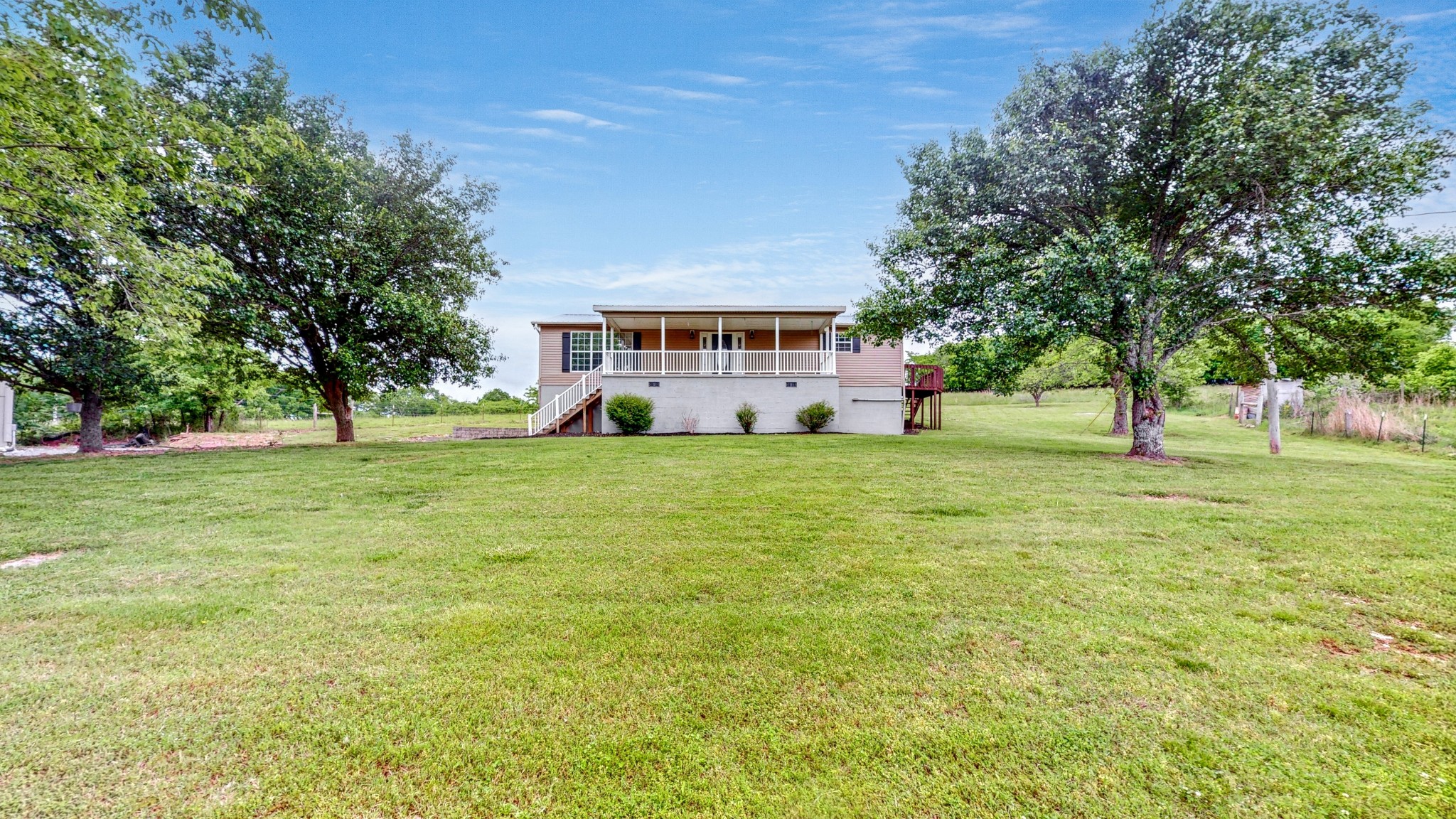 75 Vantrease Road Brush Creek, TN 38547 - Photo 27 of 72 a view of a house with a big yard and large trees